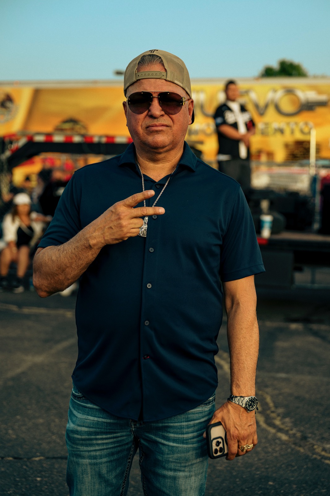 Foundation member at an outdoor event with the Nuevo Movimiento truck